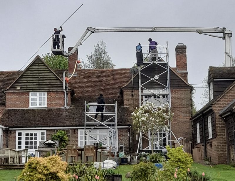 The Roof Moss Cleaners using cherry picker and scaffolding to clean roof safely and professionally in Berkhamsted, Hertfordshire