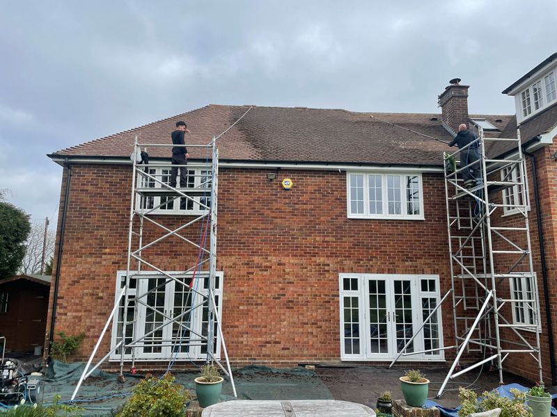 Roof cleaning carried out safely from scaffold towers by The Roof Moss Cleaners in Berkhamsted
